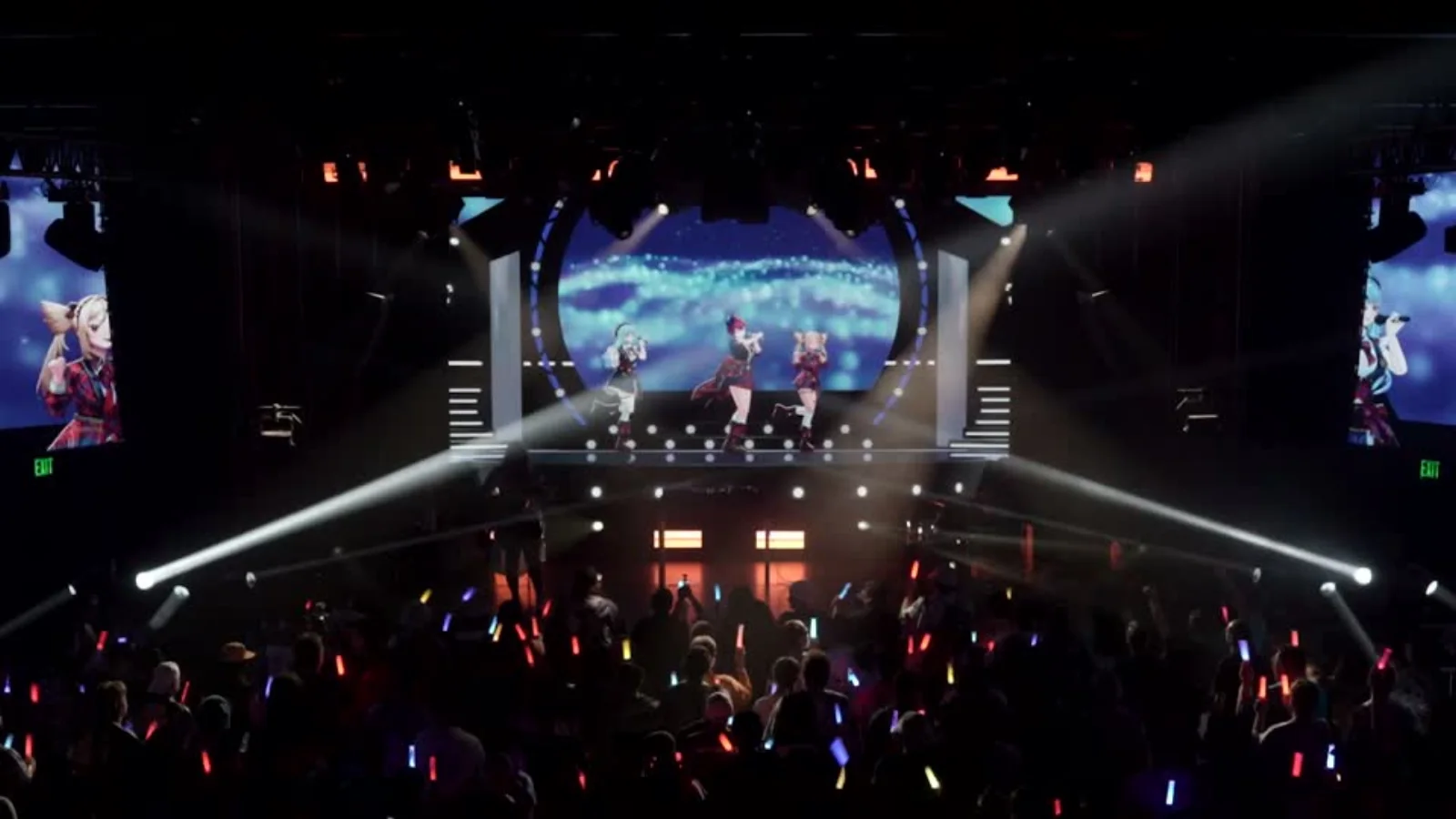 Virtual performers appearing on a live stage before an audience